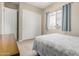 Neutral bedroom with a window, a closet, and carpeted floors at 18247 N 168Th Cir, Surprise, AZ 85374