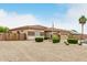 Charming single-story home featuring manicured landscaping with a spacious front yard and rock accents at 18247 N 168Th Cir, Surprise, AZ 85374