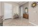 Inviting foyer featuring neutral paint, tile flooring and a sunburst mirror as decorative elements at 18247 N 168Th Cir, Surprise, AZ 85374