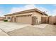 Attached garage showcases stone accents, a brick-paved walkway and low-maintenance rock landscaping at 18247 N 168Th Cir, Surprise, AZ 85374