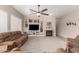 Spacious living room featuring neutral paint, carpet flooring, recessed lighting and a cozy fireplace at 18247 N 168Th Cir, Surprise, AZ 85374