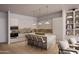 Modern kitchen featuring marble countertops, sleek appliances, and bar seating on a hardwood floor at 19360 N 73Rd St # 1066, Scottsdale, AZ 85255