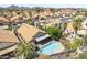 Picturesque aerial view of a neighborhood with pools and desert landscaping at 1962 E Morrow Dr, Phoenix, AZ 85024