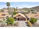 Beautiful aerial view of a home with a tile roof, desert landscaping, and mountain views at 1962 E Morrow Dr, Phoenix, AZ 85024