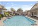 Spacious backyard featuring a sparkling pool, lounge chairs, and outdoor dining area at 1962 E Morrow Dr, Phoenix, AZ 85024