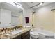 Well-lit bathroom with a granite countertop, a large mirror, and a shower-over-tub setup at 1962 E Morrow Dr, Phoenix, AZ 85024