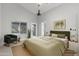 Inviting bedroom with a green bedspread, plush chair, and ample natural light at 1962 E Morrow Dr, Phoenix, AZ 85024