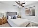 Comfortable bedroom with neutral tones, a ceiling fan, and a window with blinds at 1962 E Morrow Dr, Phoenix, AZ 85024