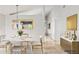 Well-lit dining room with minimalist decor and tile flooring at 1962 E Morrow Dr, Phoenix, AZ 85024