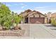 Charming single-story home with desert landscaping, tile roof, and two-car garage at 1962 E Morrow Dr, Phoenix, AZ 85024