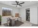 Functional home office with a modern desk, shelving, and a well-organized closet at 1962 E Morrow Dr, Phoenix, AZ 85024