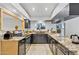 Modern kitchen with granite countertops, stainless steel appliances, and dark cabinetry at 1962 E Morrow Dr, Phoenix, AZ 85024