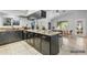 Spacious kitchen features granite countertops, dark cabinets, and an adjacent dining area at 1962 E Morrow Dr, Phoenix, AZ 85024