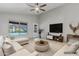 Bright living room with plush seating, modern decor, and view of the pool at 1962 E Morrow Dr, Phoenix, AZ 85024