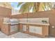 Built-in outdoor kitchen with stainless steel appliances, ideal for entertaining at 1962 E Morrow Dr, Phoenix, AZ 85024