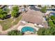 Aerial view of a backyard with a sparkling pool, lush landscaping, and a well-maintained lawn at 19903 S 187Th Dr, Queen Creek, AZ 85142