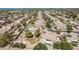 Wide aerial view featuring the backyard pool, sports court, and community landscaping at 19903 S 187Th Dr, Queen Creek, AZ 85142