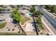 Aerial view showcasing the backyard with a pool, a basketball court, and large grassy areas at 19903 S 187Th Dr, Queen Creek, AZ 85142