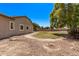 Large backyard featuring well-maintained gravel landscaping, partial view of house, and ample room for outdoor activities at 19903 S 187Th Dr, Queen Creek, AZ 85142