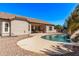 Backyard with a pool, patio, and desert landscaping at 19903 S 187Th Dr, Queen Creek, AZ 85142