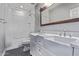 Bathroom with a dual vanity, a shower with marbled tile, and modern fixtures at 19903 S 187Th Dr, Queen Creek, AZ 85142