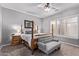 Bedroom with a four-poster bed, natural light, and a ceiling fan at 19903 S 187Th Dr, Queen Creek, AZ 85142