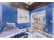 Bedroom featuring blue walls, closet and bed with blue patterned blanket at 19903 S 187Th Dr, Queen Creek, AZ 85142