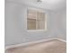 Bright bedroom features wood floors, a window with blinds, and neutral paint at 19903 S 187Th Dr, Queen Creek, AZ 85142