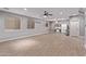 Bonus room featuring light grey walls, wood-look floors, ceiling fans and kitchenette at 19903 S 187Th Dr, Queen Creek, AZ 85142