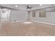Bonus room featuring light grey walls, wood-look floors, ceiling fan and windows at 19903 S 187Th Dr, Queen Creek, AZ 85142