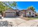 Charming single-Gathering home with a well-manicured lawn, three car garage, and neutral color palette at 19903 S 187Th Dr, Queen Creek, AZ 85142