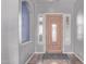 Welcoming foyer with a decorative wood door and sidelights, offering an inviting entrance to the home at 19903 S 187Th Dr, Queen Creek, AZ 85142
