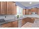 Modern kitchen with stone countertops, shaker cabinets, tile backsplash, and stainless appliances at 19903 S 187Th Dr, Queen Creek, AZ 85142