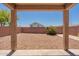An attractive covered patio overlooks the low-maintenance backyard, creating a private oasis at 23929 W Twilight Trl, Buckeye, AZ 85326
