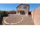 Spacious backyard featuring gravel landscaping, a covered patio and block wall fencing at 23929 W Twilight Trl, Buckeye, AZ 85326