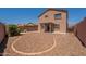 Exterior view of home featuring a low-maintenance backyard and covered patio at 23929 W Twilight Trl, Buckeye, AZ 85326