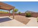 A low maintenance backyard with a covered patio, providing a versatile outdoor space at 23929 W Twilight Trl, Buckeye, AZ 85326