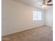 This bedroom features neutral paint, carpet, and ceiling fan at 23929 W Twilight Trl, Buckeye, AZ 85326