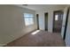 Bright bedroom featuring a window for natural light and a closet with sliding doors at 23929 W Twilight Trl, Buckeye, AZ 85326