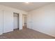 Bedroom with neutral carpet and sliding closet doors, ready for personalization at 23929 W Twilight Trl, Buckeye, AZ 85326