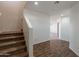 Spacious entryway featuring wood floors, a staircase, and views into the adjacent room at 23929 W Twilight Trl, Buckeye, AZ 85326