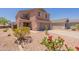 Charming two-story home with neutral exterior, well-maintained yard, and inviting curb appeal at 23929 W Twilight Trl, Buckeye, AZ 85326