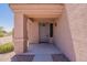 Inviting front porch featuring neutral tones, a secure front door, and low-maintenance landscaping at 23929 W Twilight Trl, Buckeye, AZ 85326