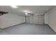 Clean and spacious two car garage with painted floor at 23929 W Twilight Trl, Buckeye, AZ 85326