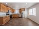 Well-equipped kitchen featuring stainless steel appliances, granite countertops, and wood-look flooring at 23929 W Twilight Trl, Buckeye, AZ 85326