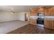 Open kitchen and living area featuring stainless steel appliances, granite counters, and modern finishes at 23929 W Twilight Trl, Buckeye, AZ 85326