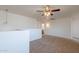 Loft featuring neutral walls, carpet, pendant, and ceiling fan at 23929 W Twilight Trl, Buckeye, AZ 85326