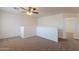 Open loft space featuring neutral paint and carpet at 23929 W Twilight Trl, Buckeye, AZ 85326