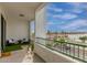 Balcony with outdoor seating overlooking palm trees and parking lot at 2511 W Queen Creek Rd # 378, Chandler, AZ 85248