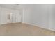 Large carpeted bedroom featuring access to the ensuite bathroom and a ceiling fan at 2511 W Queen Creek Rd # 378, Chandler, AZ 85248